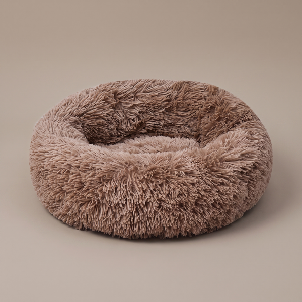 Pawzie Halo calming donut dog bed in Mocha, 100 cm long-pile faux fur with a raised ring bolster, on a plain background