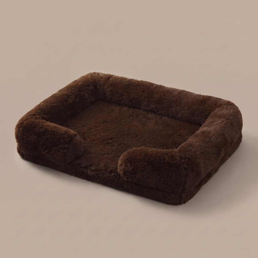 Pawzie Lounge bolstered dog sofa bed in Brown, deep faux fur with raised bolsters on three sides, on a plain background
