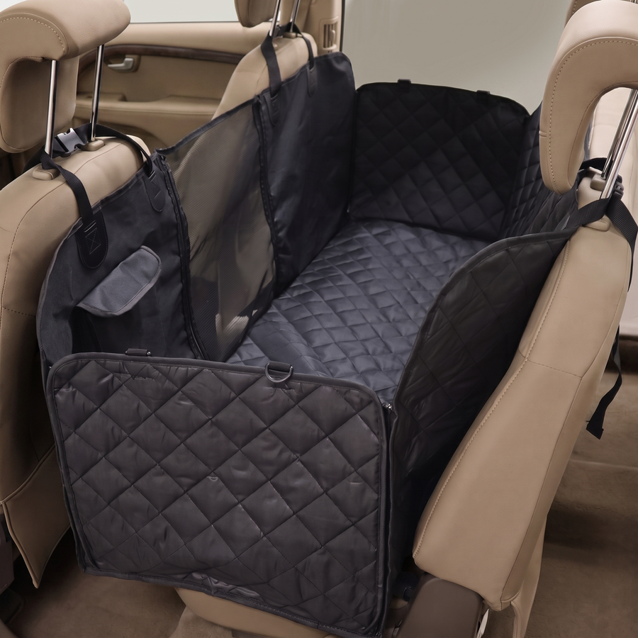 Pawzie Haven car back seat hammock in black, installed across a car rear bench with raised sides and a quilted floor