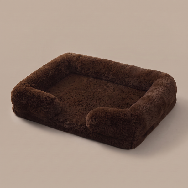 Pawzie Lounge bolstered dog sofa bed in Brown, deep faux fur with raised bolsters on three sides, on a plain background