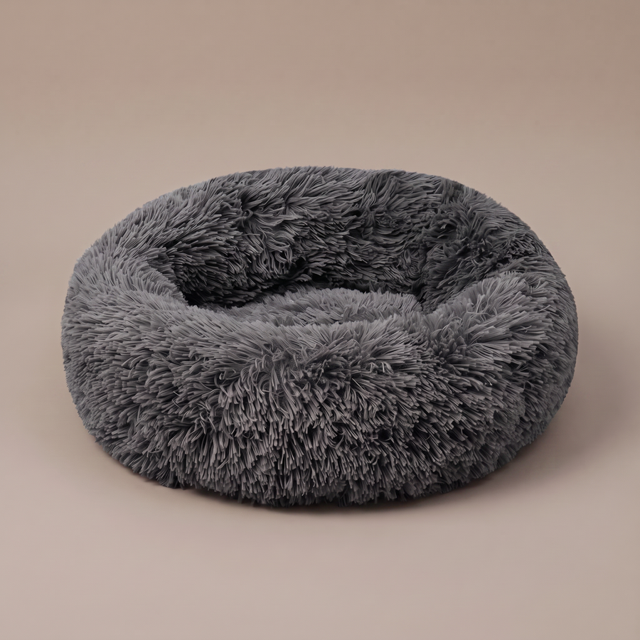 Pawzie Halo calming donut dog bed in Charcoal, shown on a plain background